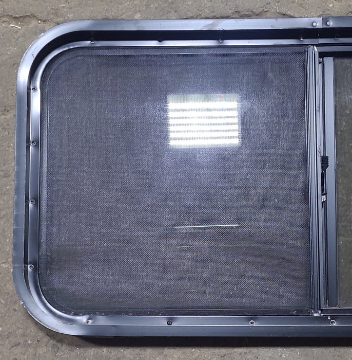 Used Slanted Black Radius Opening Window : 41 3/4" W x 17 3/4" H x 1 7/8" D - Young Farts RV Parts