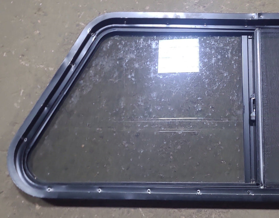 Used Slanted Black Radius Opening Window : 41 3/4" W x 17 3/4" H x 1 7/8" D - Young Farts RV Parts