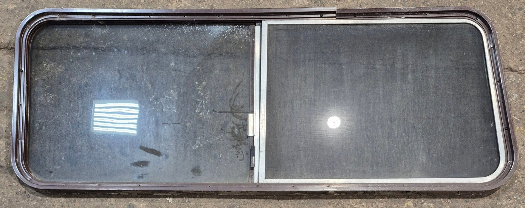 Used Slanted Brown Radius Opening Window : 55 1/2" W x 19 3/4" H x 1 1/4" D