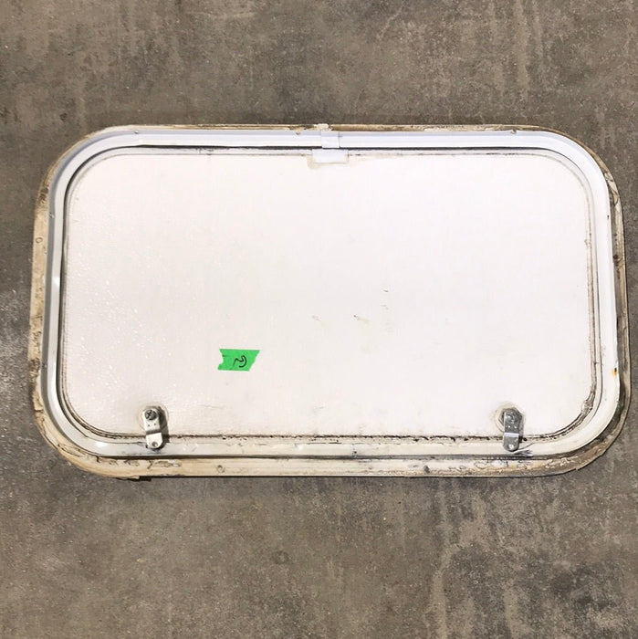 Used White Corner radius cargo door  23 3/4" W x 13 3/4" H x 1"D